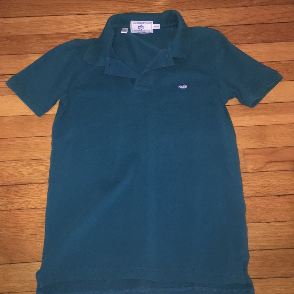 Turquoise polo shirt. Size:medium/ 10-12